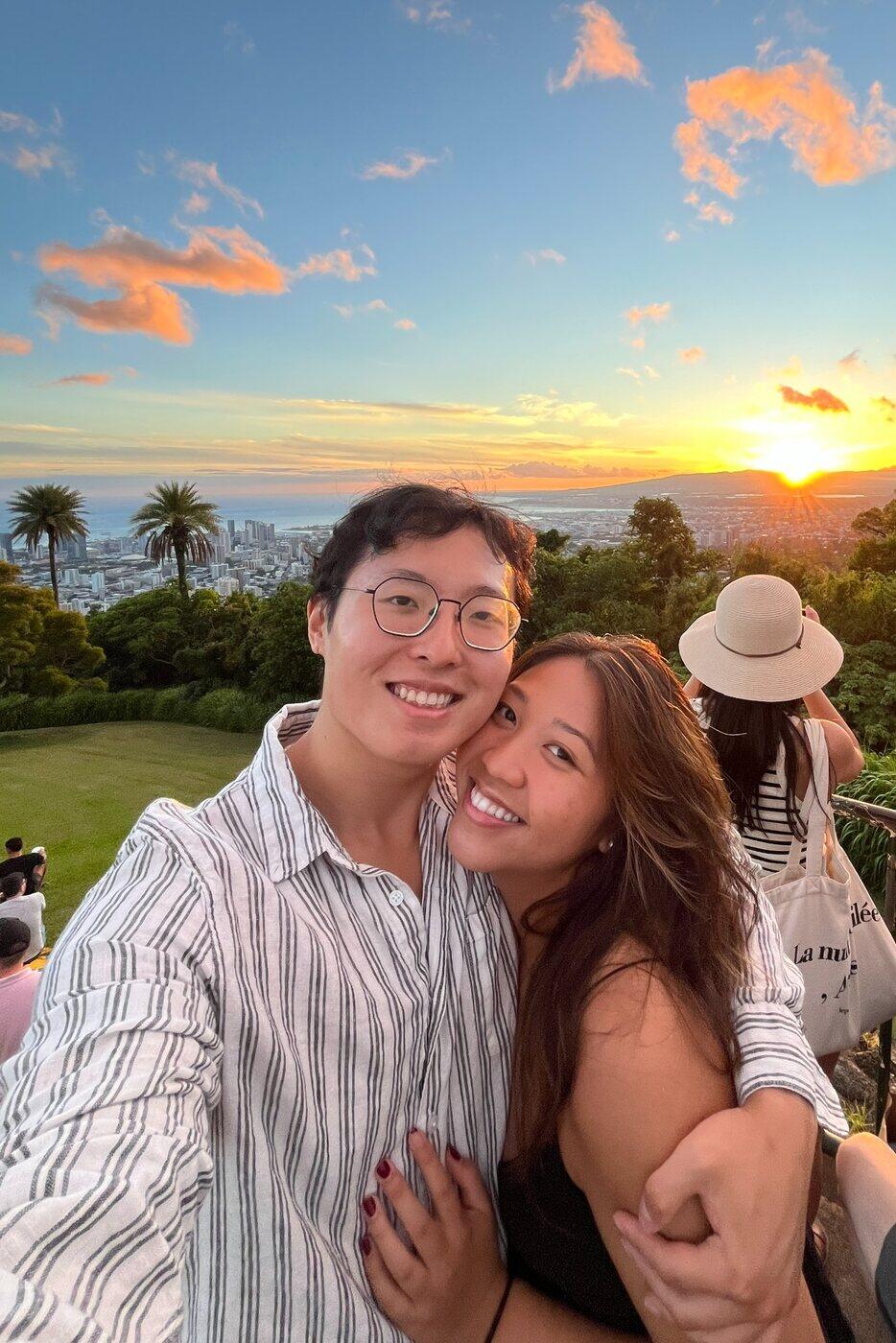 Alec and Shania embracing at sunset