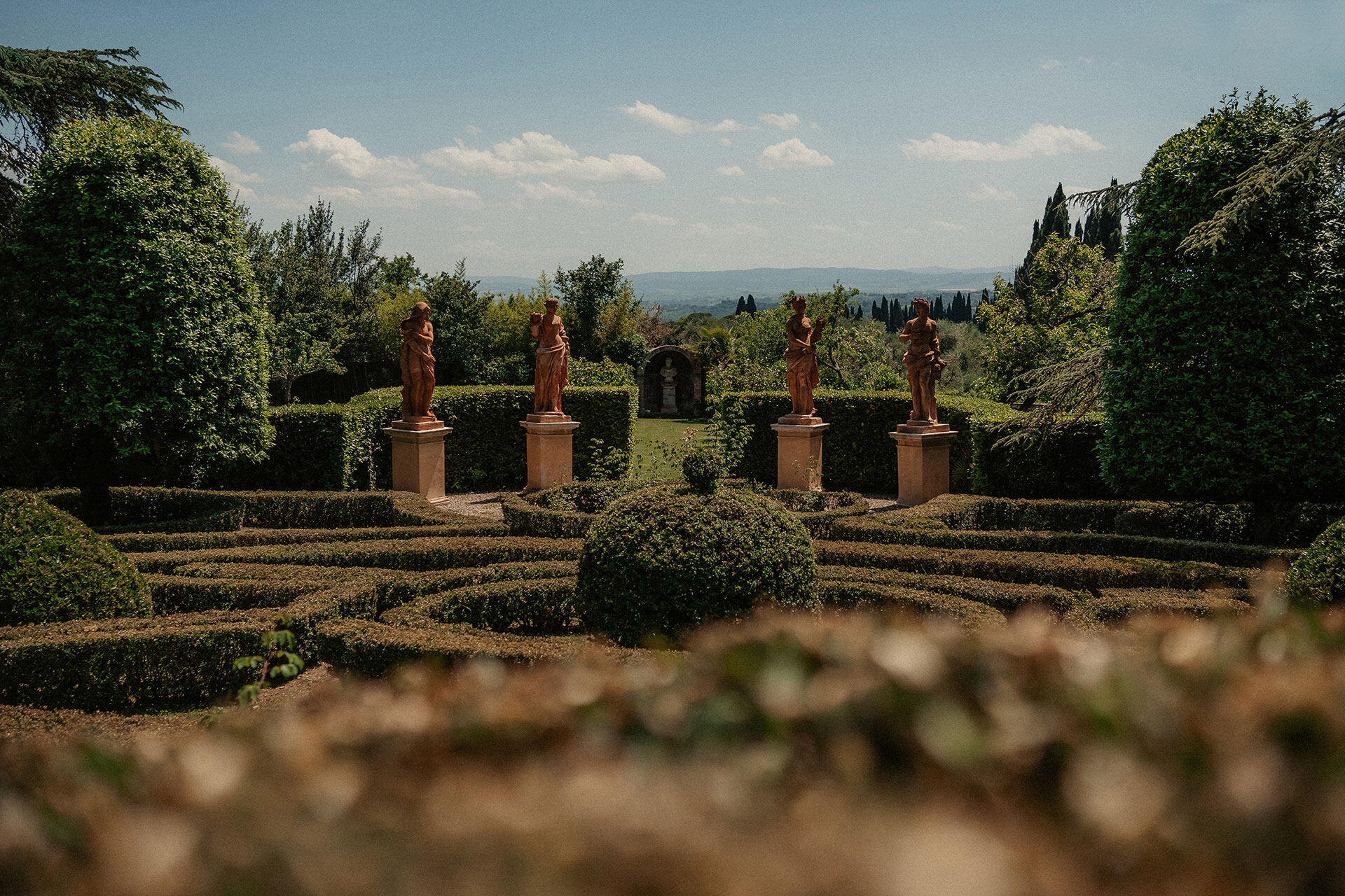 The statue garden at Villa Catignano overlooking the Tuscan countryside